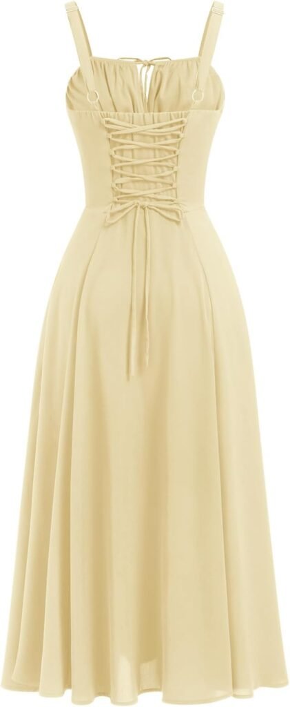 Robe midi jaune pâle à bretelles et lien noué sur le décolleté.