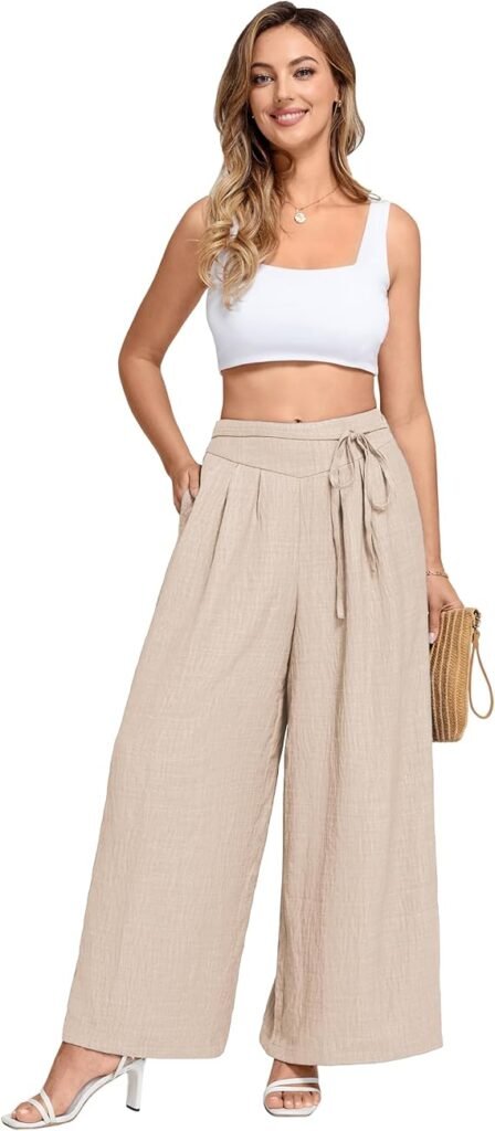 Pantalon fluide beige clair à taille haute nouée.