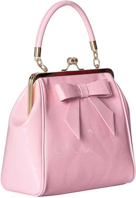 Sac à main vintage rose bonbon avec anse rigide, fermoir rétro doré et nœud décoratif.